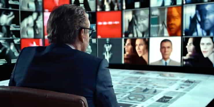 Conscious Choices: Reprogram Your Subconscious Mind A man on a directors chair stairs at a screen of his mind - reprogram your subconscious mind